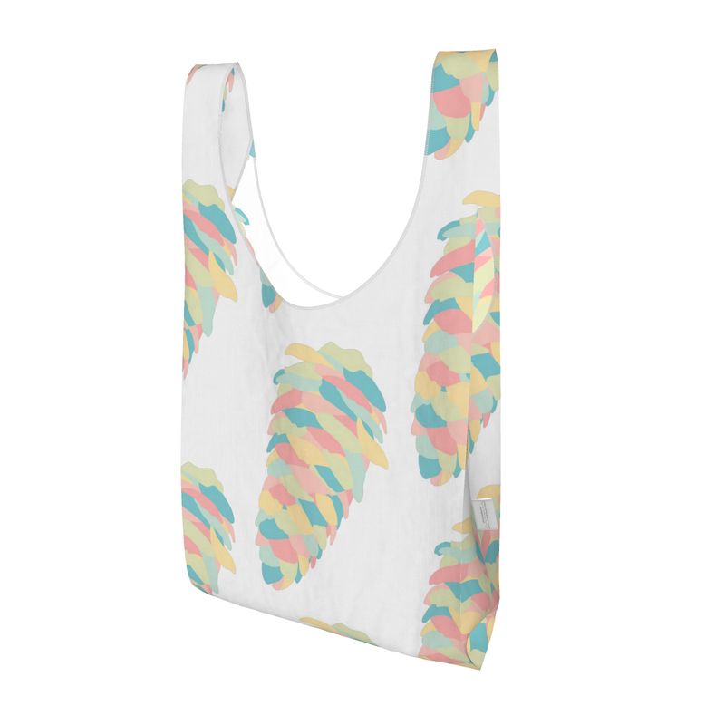 A light shopping bag  printed with a pattern of colourful cones, created by Abroadland Creative Studio